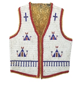 Wonderful youth size 1890's fully beaded vest, beautifully done on hide with sinew, displaying a