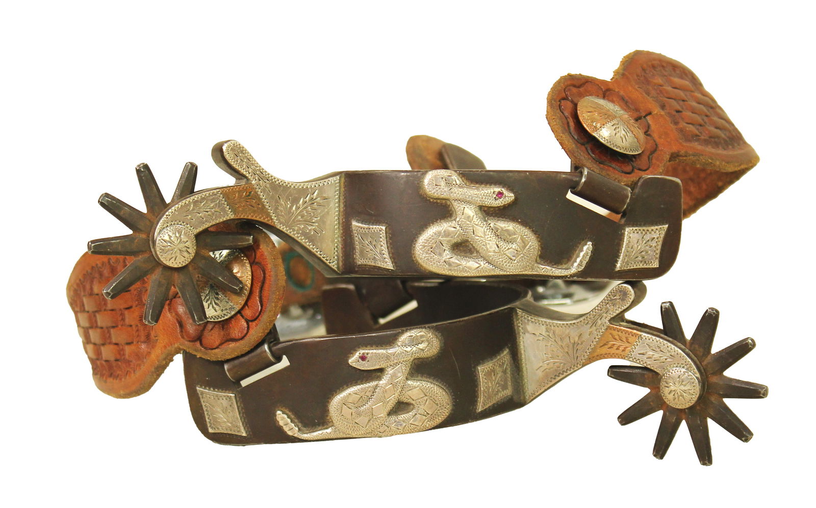 Randy Butters Spurs: Large pair of single mounted spurs by a highly collected maker, done with a coiled snake pattern, showing mint excellent condition. Provenace: Dick Engel Collection