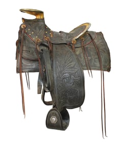 Incredible 19th century halfseat saddle with profusely hand carved floral pattern, showing large
