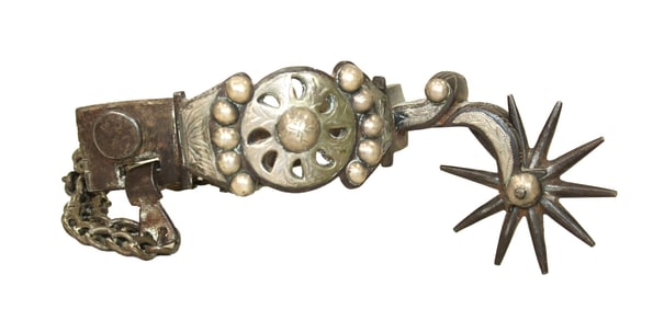 Striking double mounted very early spur with classic Tapia characteristics like large pierced