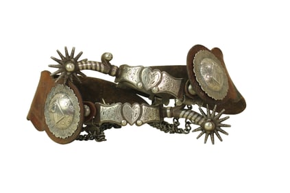 Beautifully presenting pair of single mounted G.S.Garcia spurs with fabulous heart pattern on