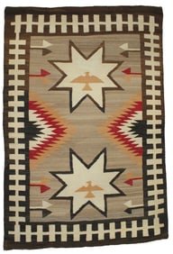 Fabulous brightly colored Navajo textile with figural Thunderbirds, and exagerated border.
