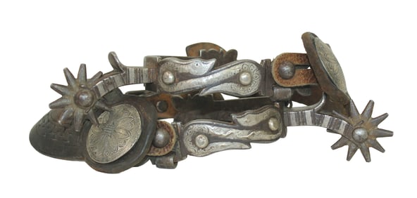 Sought after Buerman pattern of single mounted silver inlaid snakes. An early pair of spurs with