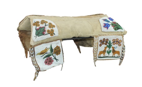 Extraordinary turn of the Century Native American pad saddle, larger than most that we have seen