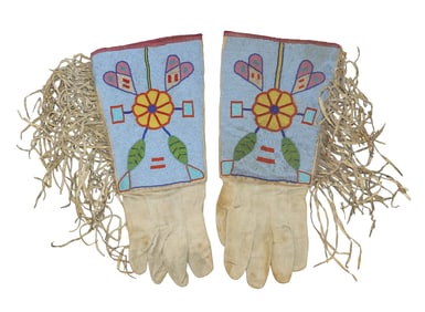 Eye catching gauntlets with oversized cuffs with beautifully floral beaded design on light blue