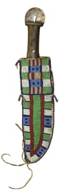 Large Blackfoot beaded knife sheath with wonderful full coverage pattern of early beads, completed