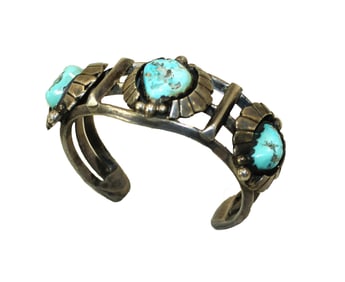 Heavy Native American hand crafted sterling silver bracelet, adorned with nicely colored tuqiouse
