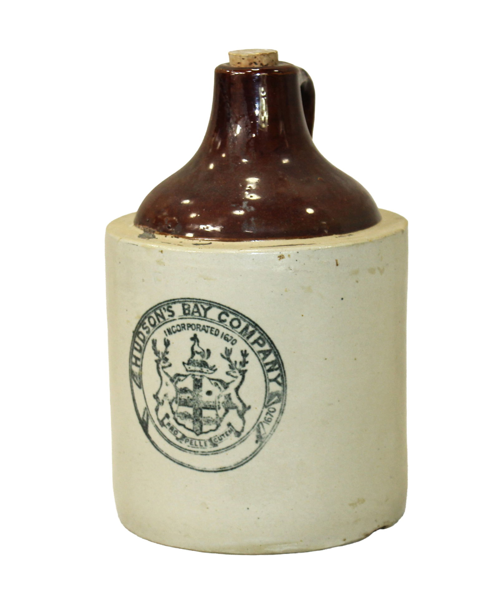 Hudson Bay Jug: Very scarce early one gallon crock jug with great original stenciled label, In very nice condition and measuring approximatley 11" in height.