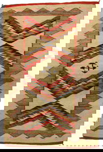 Navajo Weaving: An interesting Native American textile showing great color and rug in rug pattern, measuring 48"x 72".