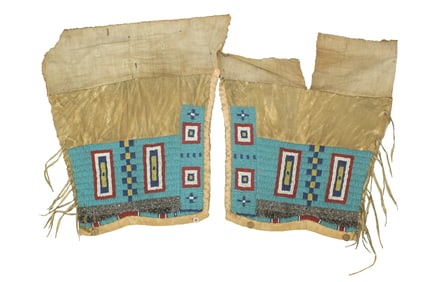 Terrific pair of Northern Plains leggings, heavily beaded on hide with an interesting light blue