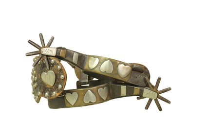 Very popular single mounted Four Heart pattern spurs with two-tone design, swinging heart buttons,