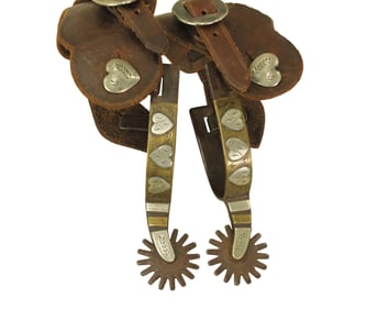 An interesting pair of late marked Kelly spurs in the popular two-tone Four Heart pattern, with