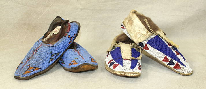 A grouping of two pairs of Northern Plains Indian beaded moccasins; 1) with interesting pattern and: A grouping of two pairs of Northern Plains Indian beaded moccasins; 1) with interesting pattern and rare complete blue beaded coverage, a little stiff. 2) nicely done moccasins, with buffalo track