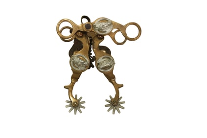 A highly collected set of August Buerman Hercules bronze spurs and matching bit with three