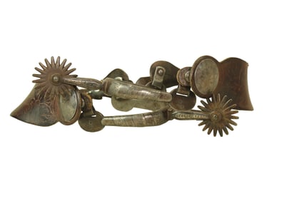 Popular early single mounted Buerman silver inlaid spurs with rounded heelbands, shaped straight