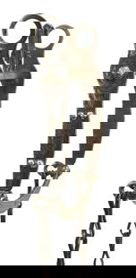 An unmarked California style bit that is easily identified as a pattern done by Mike Morales for: An unmarked California style bit that is easily identified as a pattern done by Mike Morales for Hamley Saddlery. With a beautiful silver inlaid design and halfbreed mouthpiece.