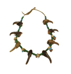Striking Native American beaded necklace, strung on hide with 8 bear claws spaced throughout.