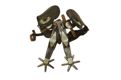 Wonderful pair of single mounted Texas style spurs with finely engraved diamond pattern, accented by