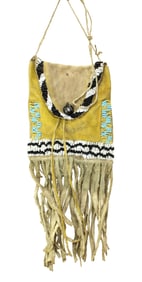 A good looking Northern Plains hide bag with great yellow ochre, interesting beadwork and long