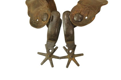 Massive pair of Kelly Bro's Mexican style iron spurs with extra large 6-point rowels and tooled