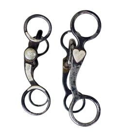 Two extra nice iron grazing bits; 1) A well makred K&C bit with heart pattern. 2) A McChesney silver