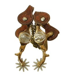 Mint condition pair of Hercules bronze horsehead spurs, nicely marked with Buerman stars.