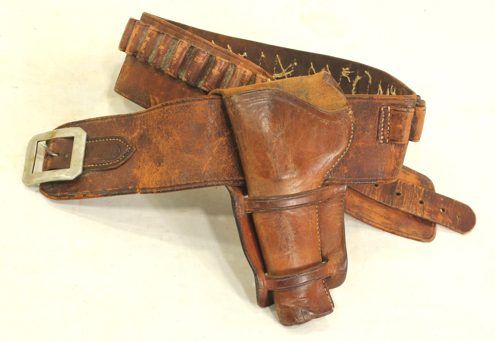 C.P. Shipley Gun Rig: Nice maker marked leather money belt and matching Colt 1877 Thunderer double loop holster.