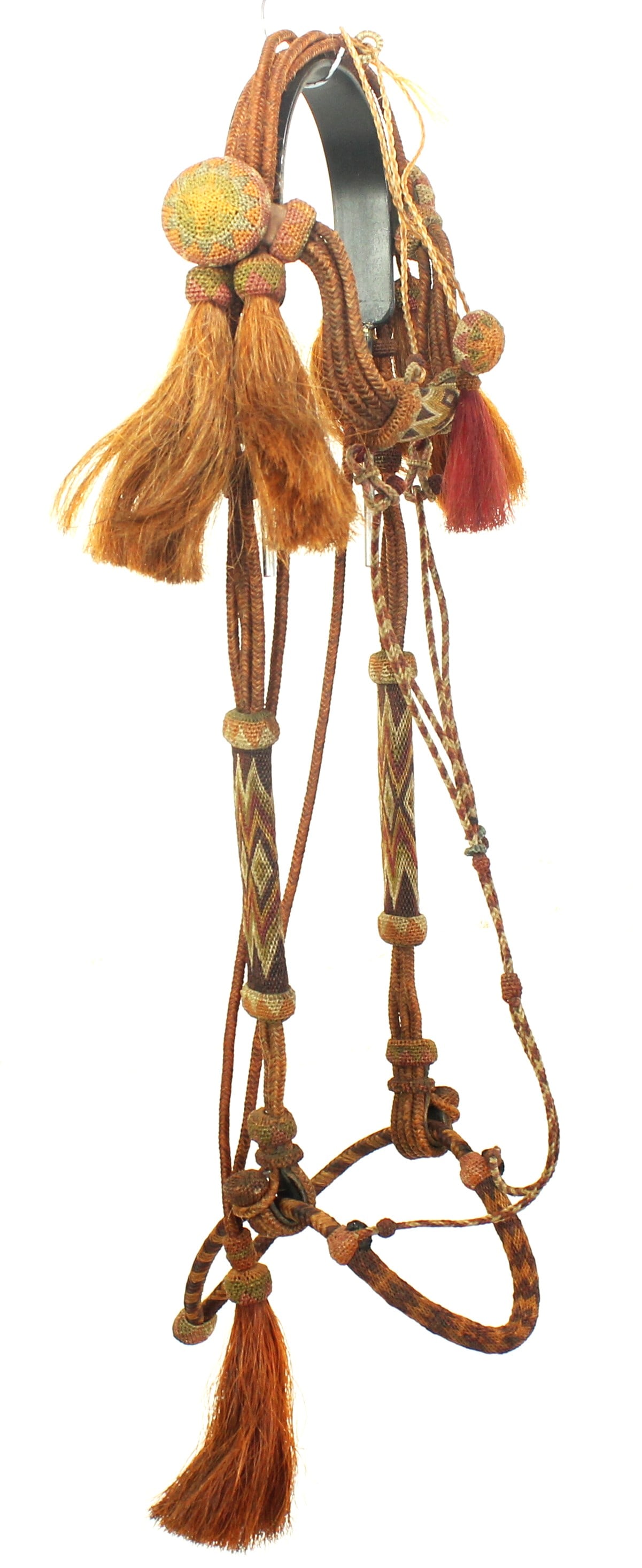 Yuma Horsehair Bridle: Uniquely colored hitched horsehair headstall with incorporated bosal, featuring colorful horsehair accents, tassels, and finished by its signature large needle knot rosettes. Attractive craftsmanship