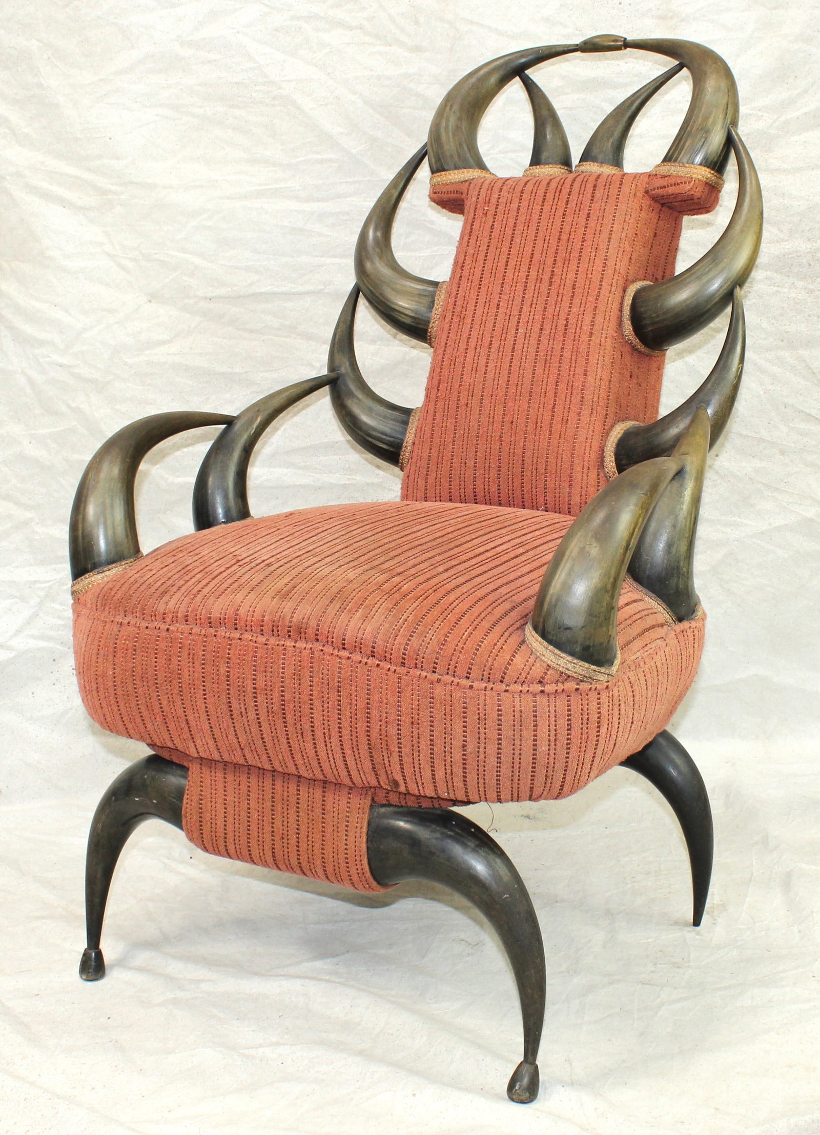 Extremely Rare Buffalo Horn Chair: Magnificent custom-made armchair constructed entirely from 16 beautifully patinaed buffalo horns, with upholstered seat and back. Showing great style and condition. An outstanding example of Western