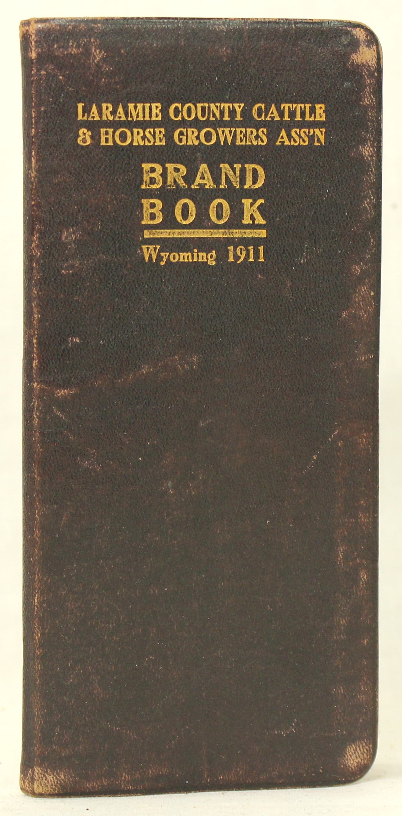 Scarce Wyoming 1911 Brand Book: Terrific pocket-size early Wyoming brand book issued by the Laramie County Cattle & Horse Growers Association. In very nice condition. An important early Wyoming ranching document.