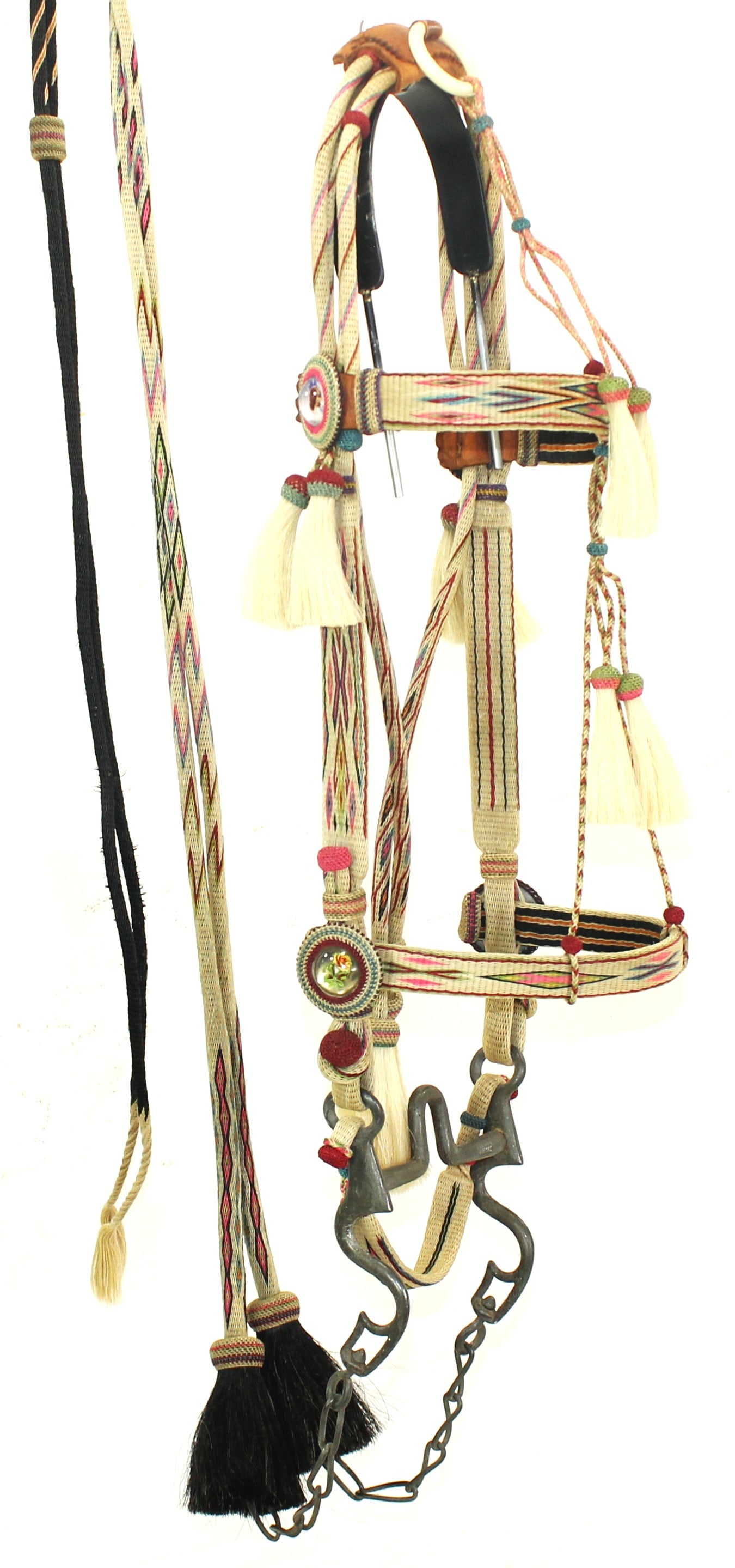 Deerlodge Horsehair Bridle: An eye popping Montana made bridle with extremely crisp colors and hitched hair, that include face tassels, hitched rosettes, curb strap, and split reins. Completed by its original iron bit. A great