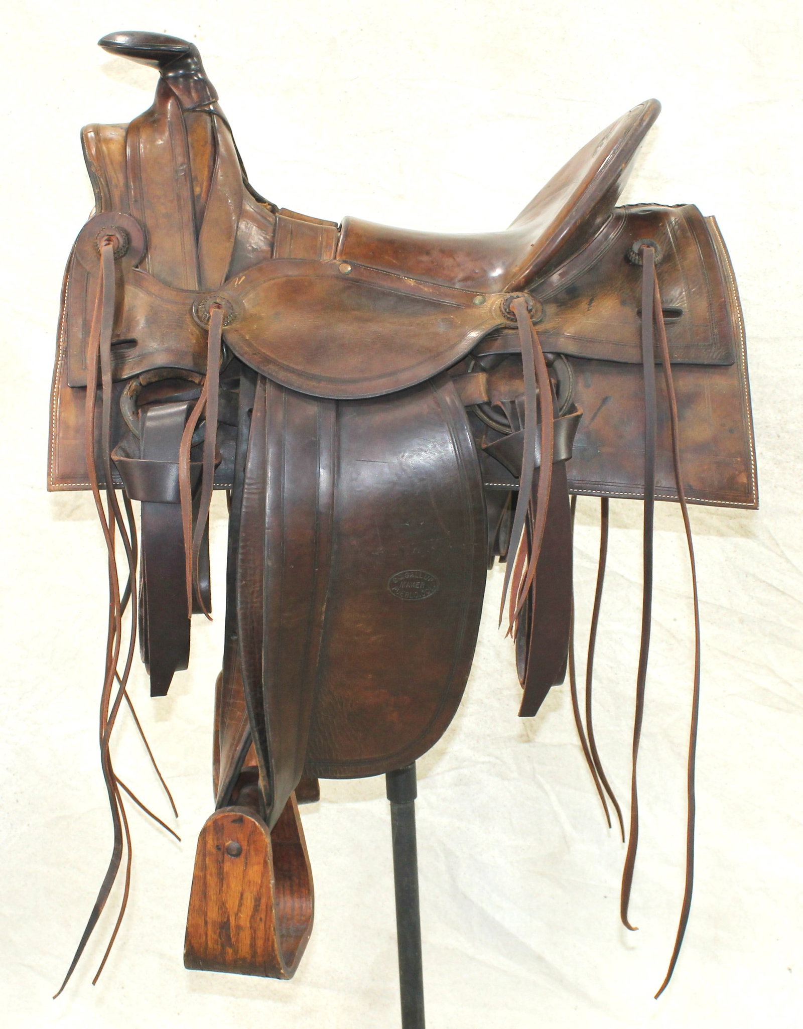 Early S.C. Gallup Saddle: Outstanding iconic half-seat saddle with Sam Stagg front end, large square skirts, massive horn, 16” seat, and radical 5” tall cantle. A special saddle, well marked, and displaying