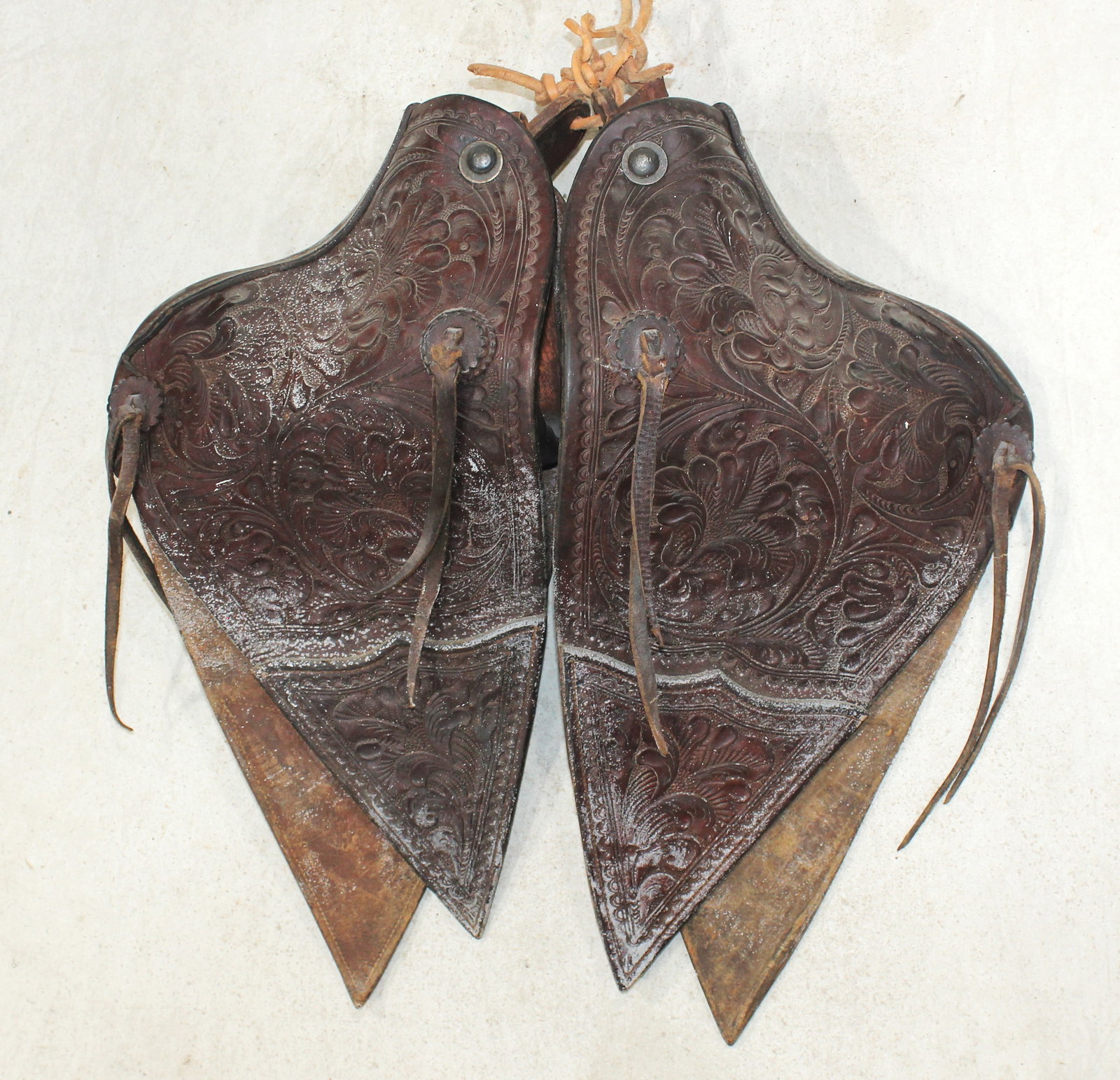 Flower Tooled Tapaderos: A terrific pair of California style fully flower tooled tapaderos, showing great color and condition. Measuring 20" in length.
