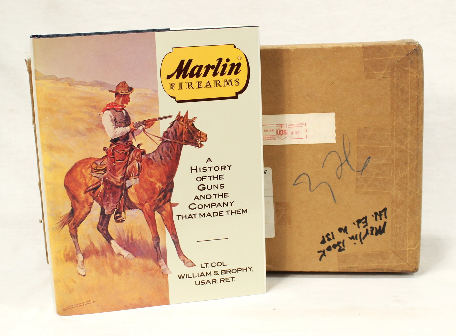 "Marlin Firearms" Book: A fantastic informational hard backed book with its orinal mailing box, "Marlin Firearms", by Lt. Col. William S. Brophy USAR Ret., in very good condition. Leland Clapp collection.