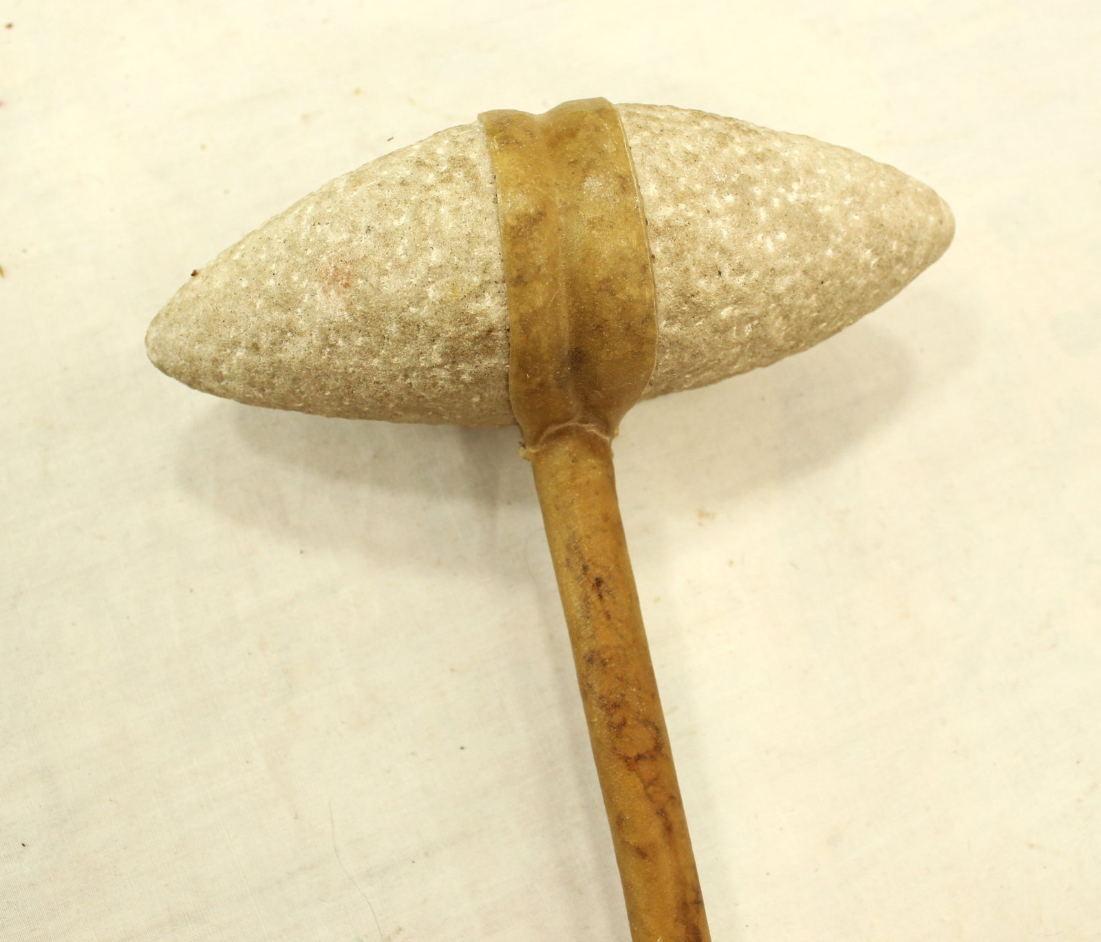 Native American Club: A stone head war club with conical shaped granite head, and rawhide wrapped haft. Measuring 17" long.