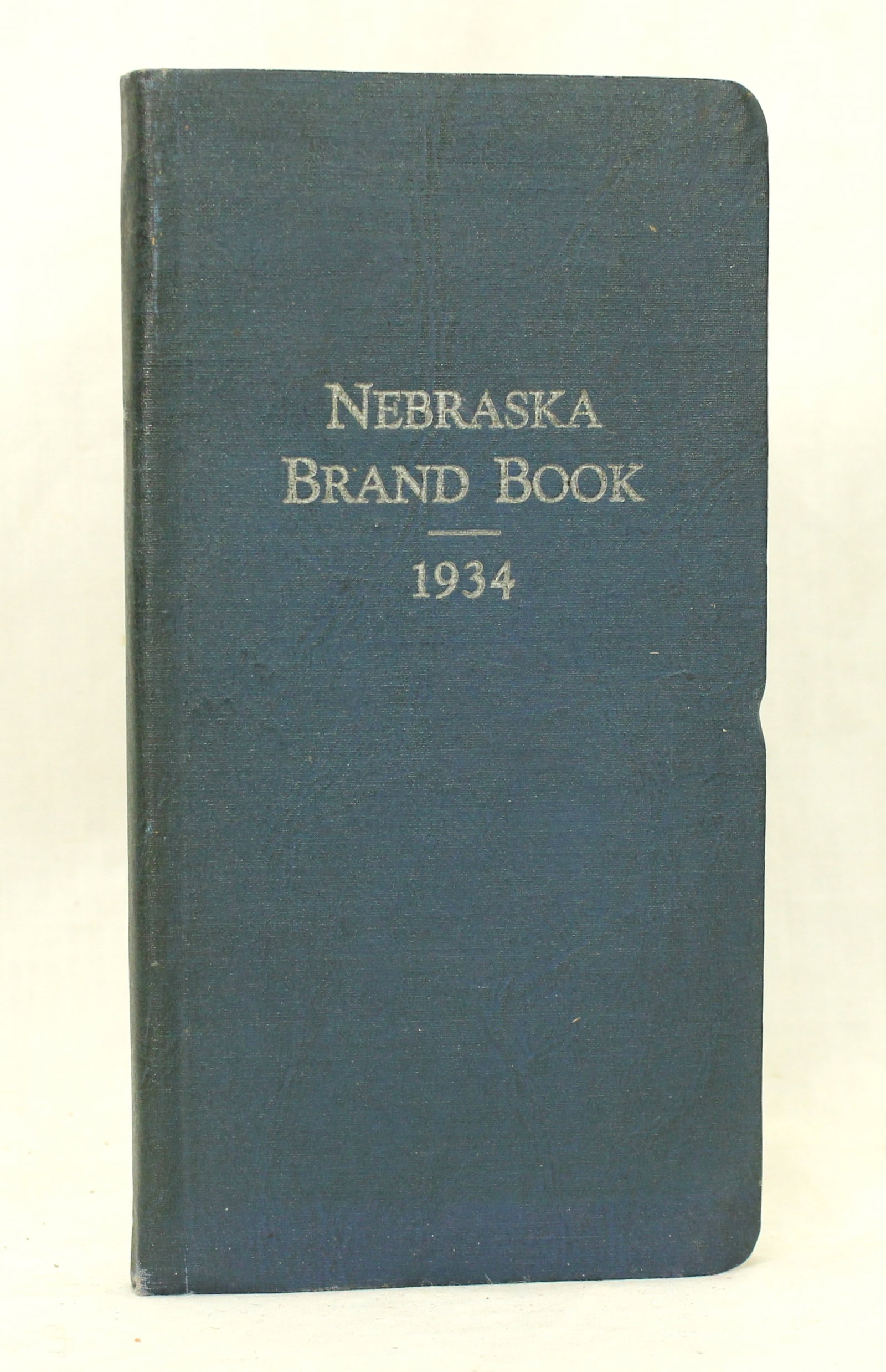 Nebraska Brand Book: A hard backed original copy of the Nebraska 1934 pocket brand book, in very nice condition.