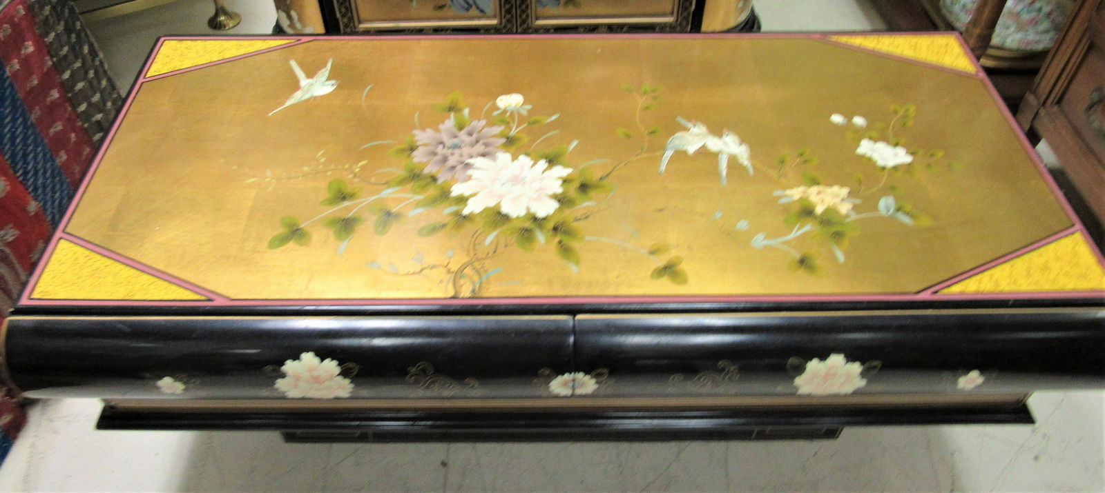 Vintage Chinese hand painted solid wood table: A lovely hand painted, solid wood piece. The top has two small sliding drawers. It is 42' across and 17" high - perfect for the foot of the bed.