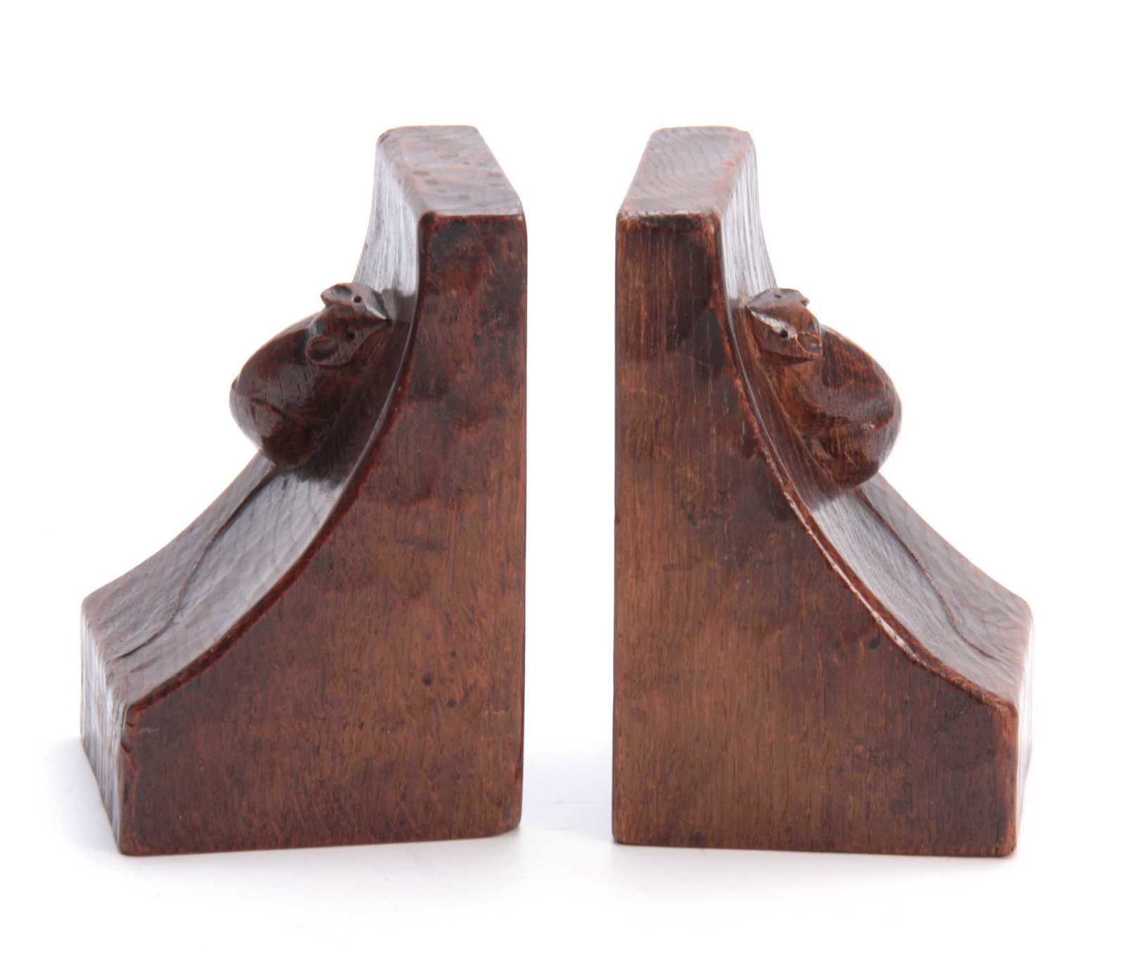 A GOOD EARLY PAIR OF ROBERT MOUSEMAN THOMPSON ADZED OAK: A GOOD EARLY PAIR OF ROBERT MOUSEMAN THOMPSON ADZED OAK BOOKENDS OF RICH COLOUR AND PATINA each with a massive carved mouse trademark to the front 9cms by 9.5cms 15cms high