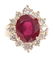 A LADIES 14ct GOLD RUBY AND DIAMOND RING having a