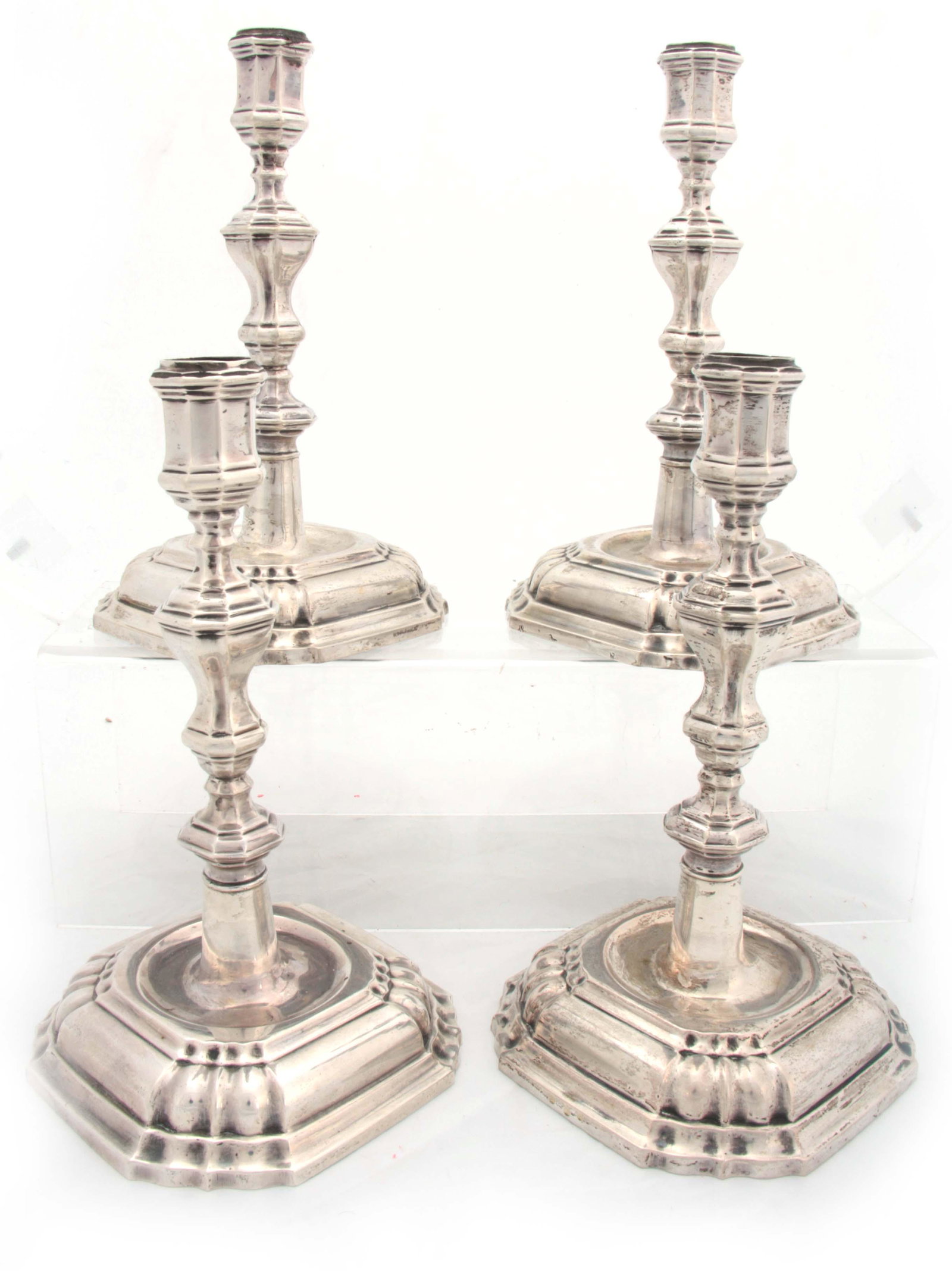 A SET OF FOUR CONTINENTAL CAST SILVER CANDLE STICK (1 of 1)