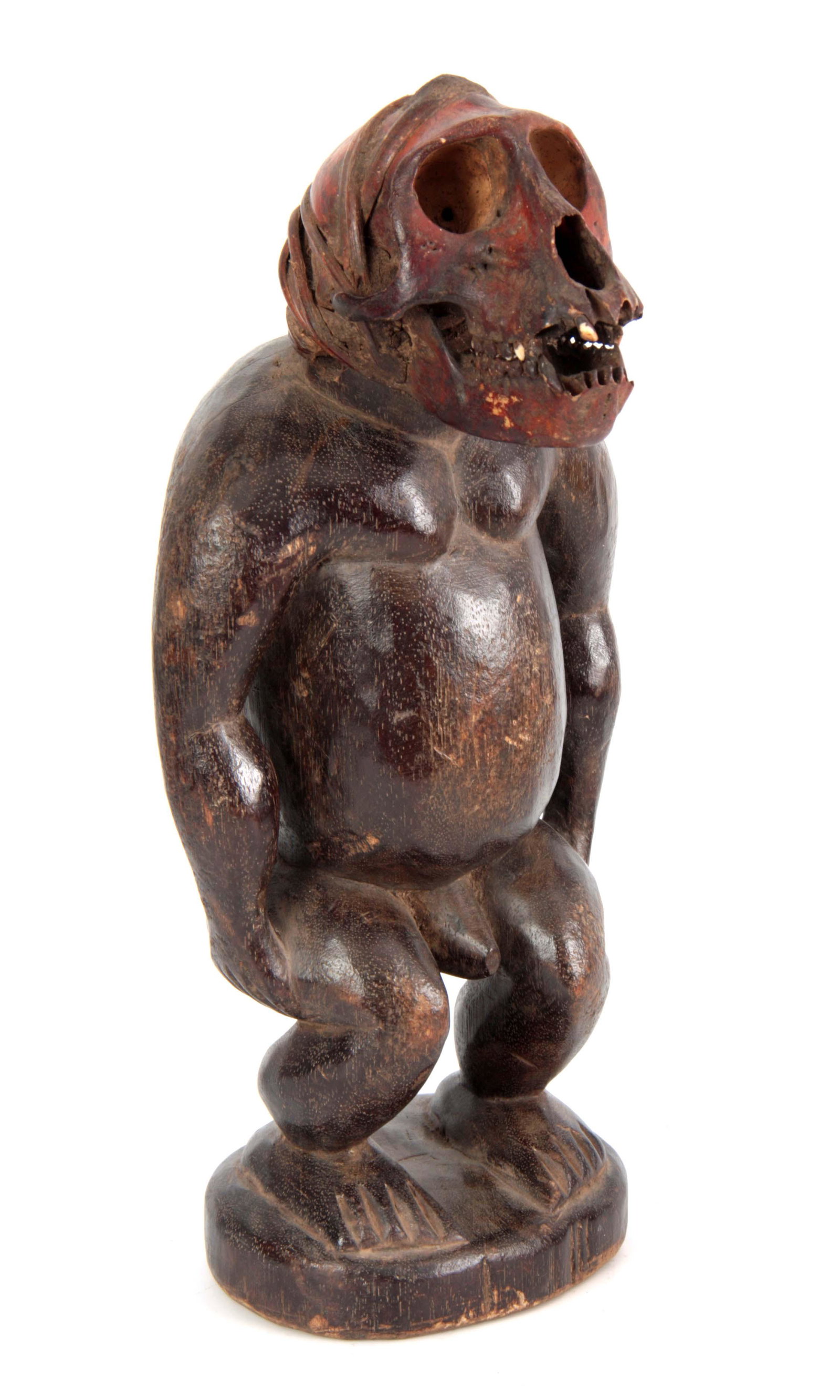 A LATE 19TH CENTURY AFRICAN CARVED FIGURE with mon (1 of 1)