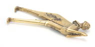 A 19TH CENTURY BRASS FIGURAL BETEL NUT CUTTER with