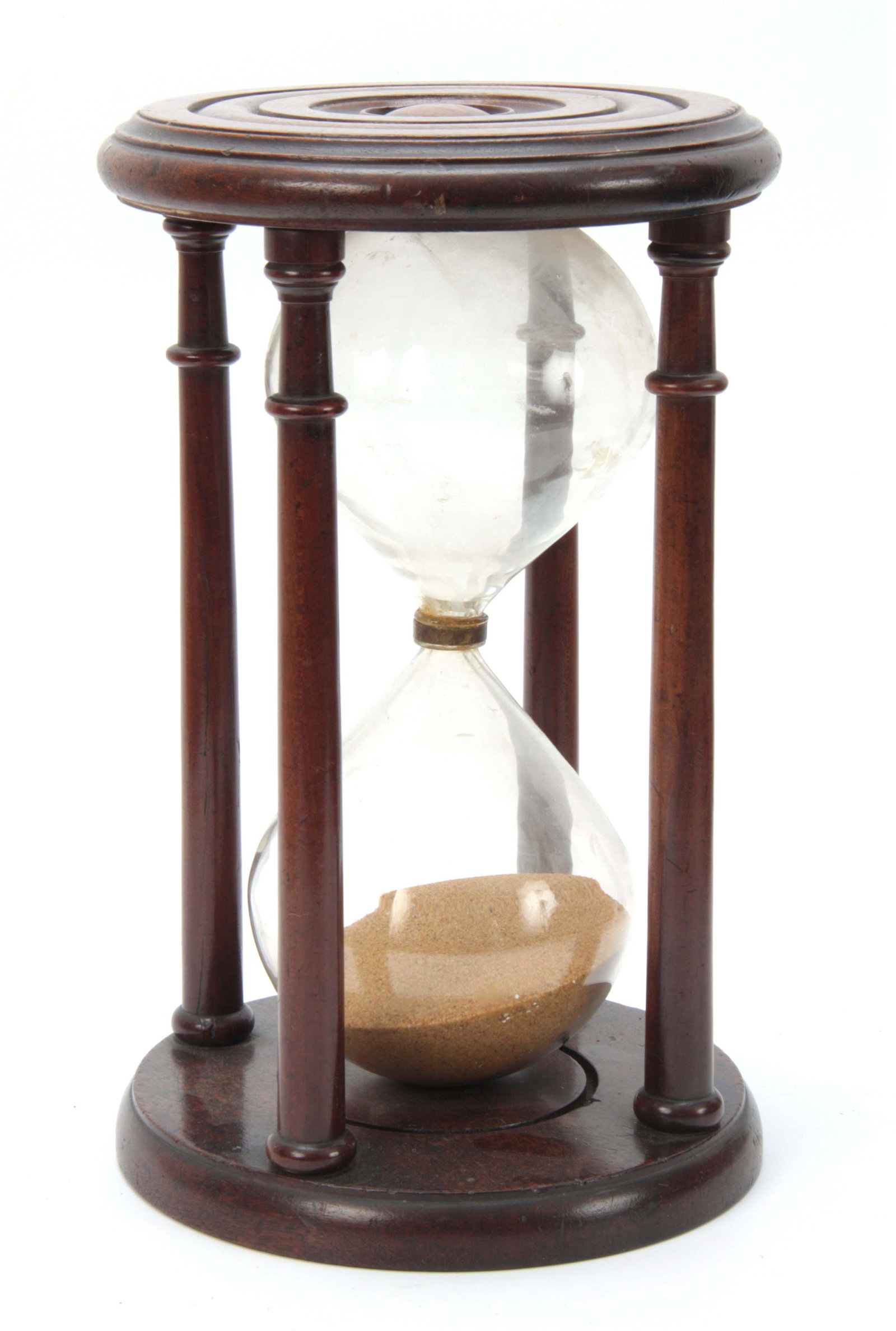 A LARGE GEORGE III MAHOGANY SAND GLASS having a tu: A LARGE GEORGE III MAHOGANY SAND GLASS having a turned top supported on four turned pillars enclosing a glass bulb containing volcanic sand 34cm high