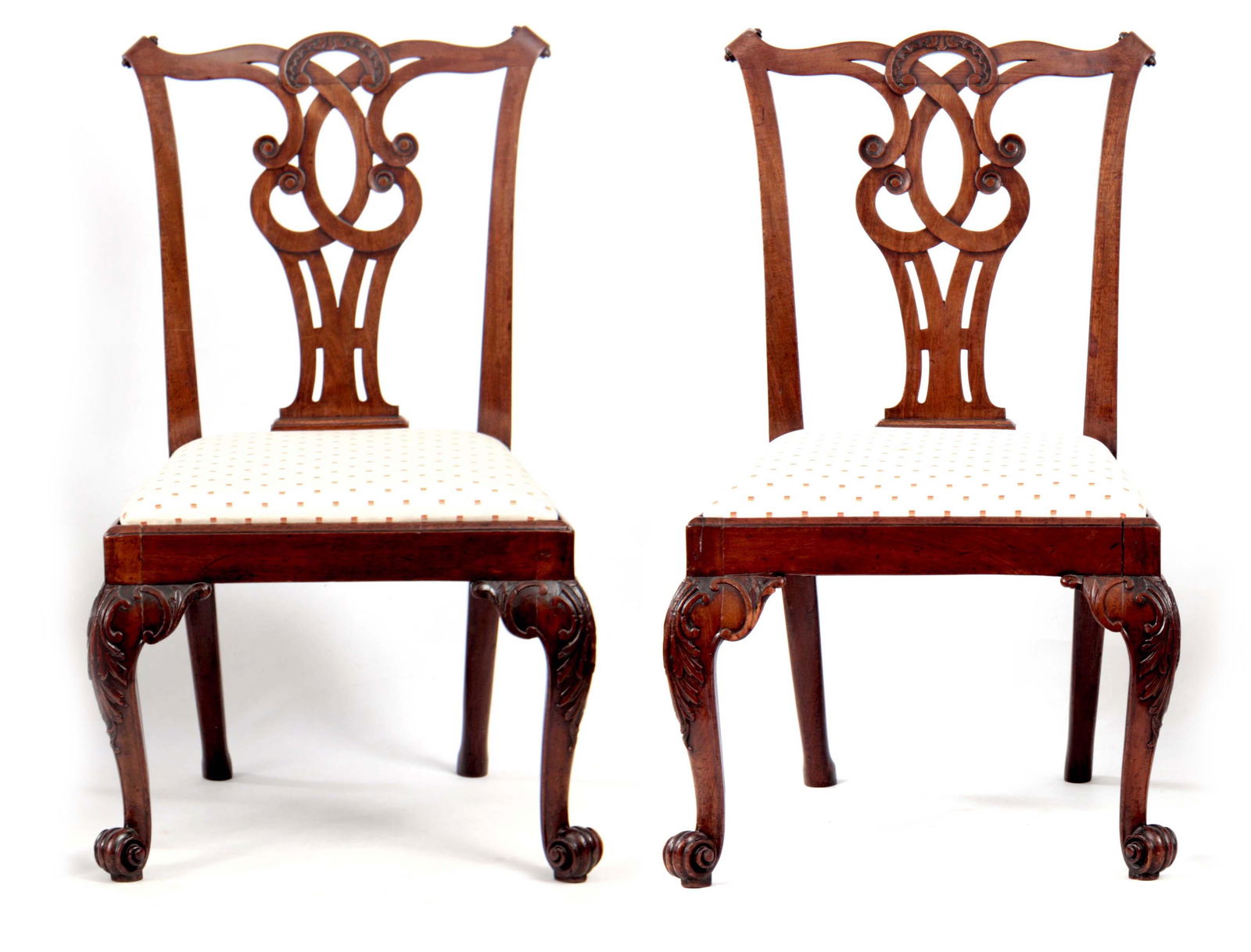 A FINE PAIR OF MID 18TH CENTURY AND TWO LATER MAHO: A FINE PAIR OF MID 18TH CENTURY AND TWO LATER MAHOGANY DINING CHAIRS IN THE MANNER OF THOMAS CHIPPENDALE having a shaped top rail with scrolled ears above a C scrolled interlaced pierced centre splat,