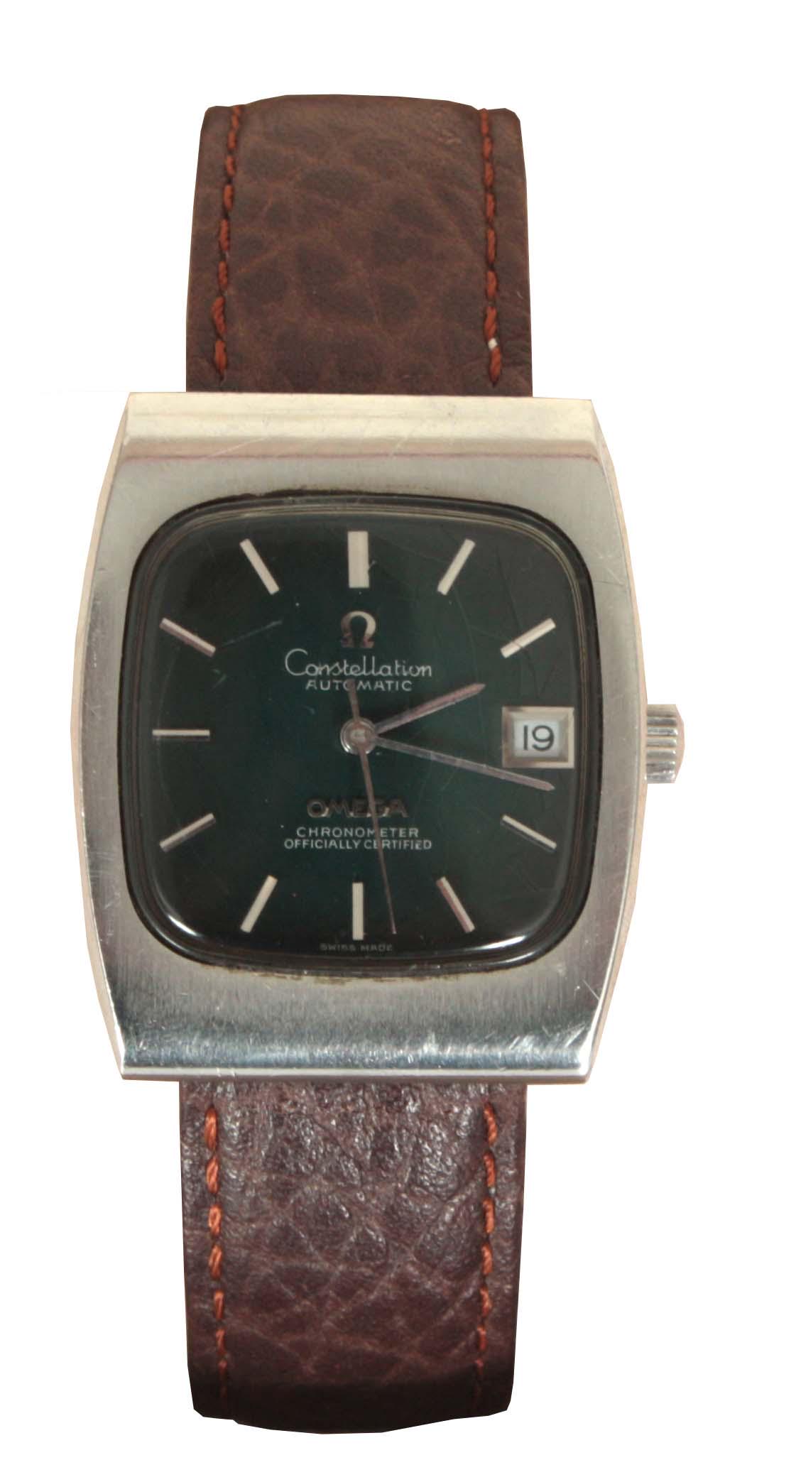 A 1960's STEEL OMEGA CONSTELLATION AUTOMATIC WRIST: A 1960's STEEL OMEGA CONSTELLATION AUTOMATIC WRIST WATCH on a brown leather strap, having a green dial with baton markers, sweeping seconds hand and calendar aperture fronting a self-winding chronomet