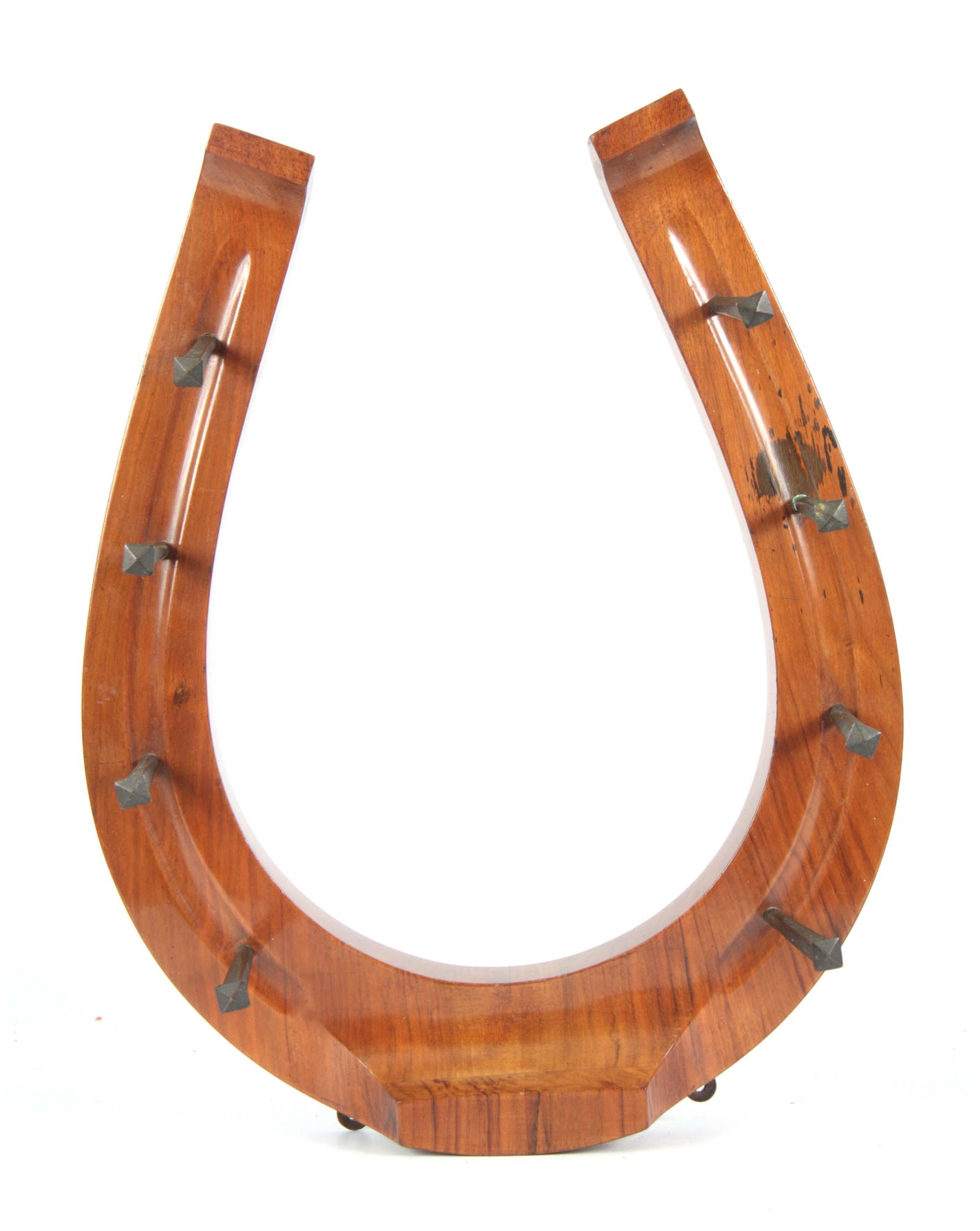 A LATE 19TH CENTURY WALNUT HORSESHOE SHAPED HANGIN: A LATE 19TH CENTURY WALNUT HORSESHOE SHAPED HANGING COAT HOOK with square nail pegs 47.5cm high 38cm wide