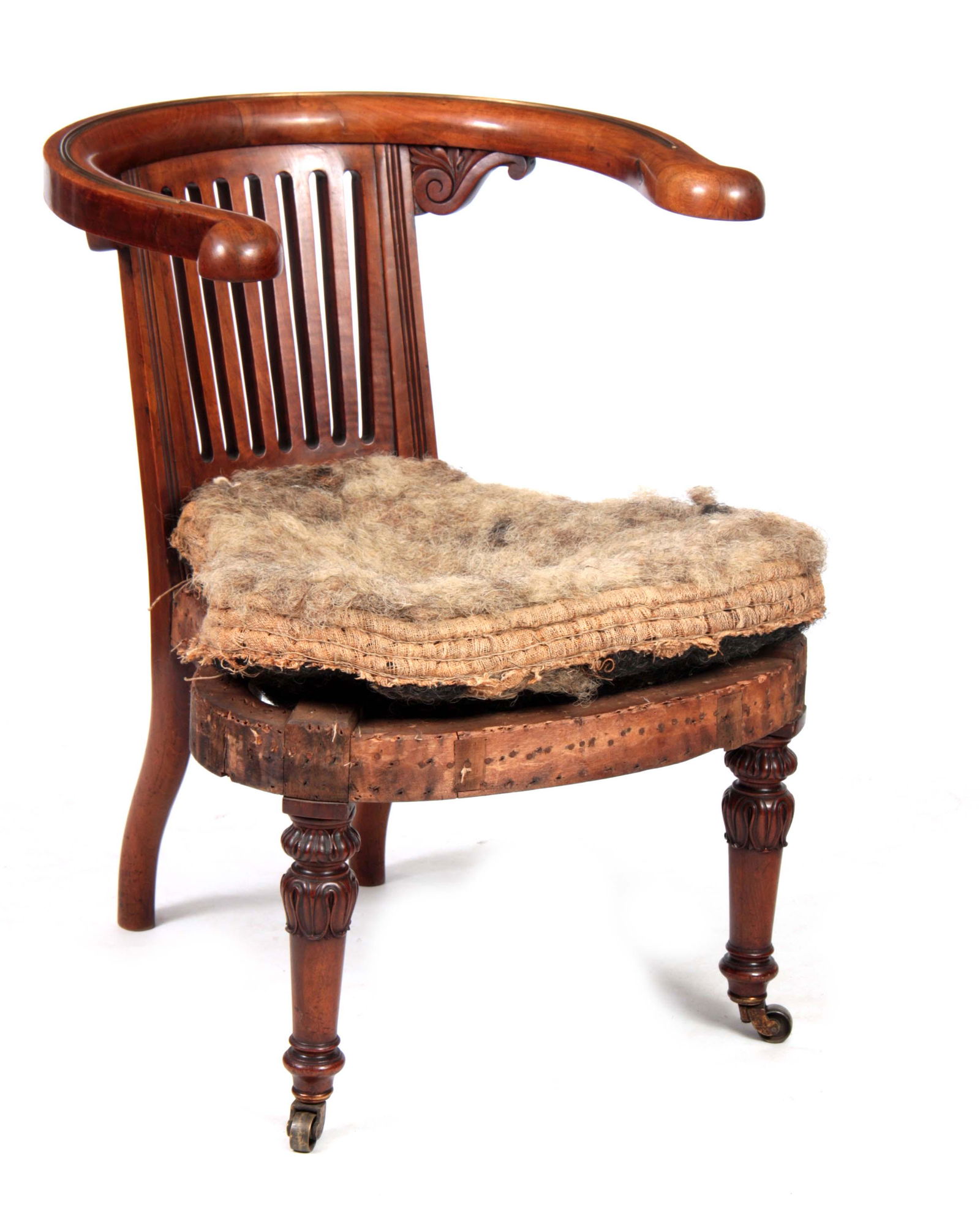 A REGENCY MAHOGANY LIBRARY READING CHAIR BY CHRIST: A REGENCY MAHOGANY LIBRARY READING CHAIR BY CHRISTOPHER PRATT & SONS BRADFORD the hooped back rail formally with an adjustable reading slope and slatted back splat with leaf carved corners above a sha