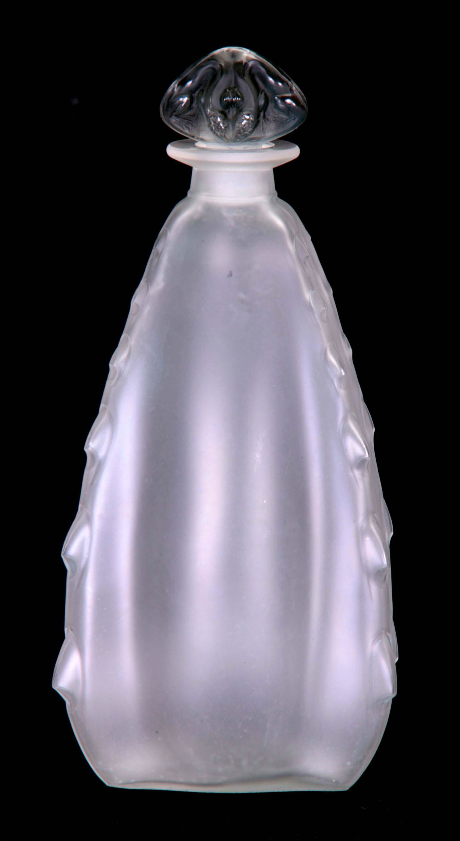 AN R LALIQUE LEZARD PERFUME BOTTLE FOR COTY Circa 1912: AN R LALIQUE LEZARD PERFUME BOTTLE FOR COTY Circa 1912 the frosted rounded rectangular tapered body with notched corners and smoked moulded stopper modelled as a frog 24cm high - engraved Lalique and