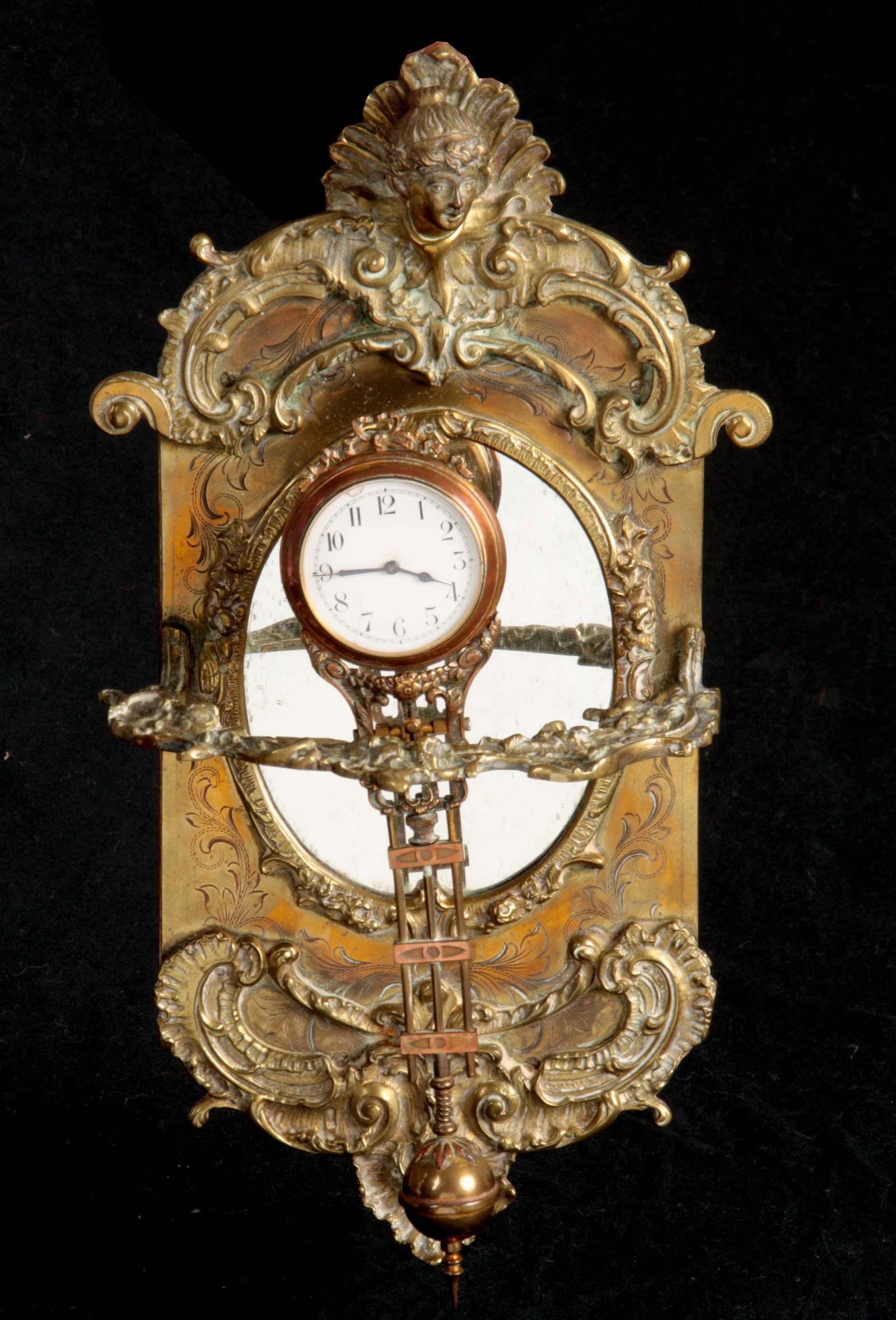 A LATE 19TH CENTURY SWINGING MYSTERY CLOCK with spring (1 of 1)