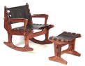 A 20TH CENTURY TEAK ROCKING CHAIR AND FOOTSTOOL BY